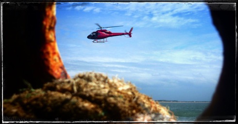 My chopper lies over the ocean.